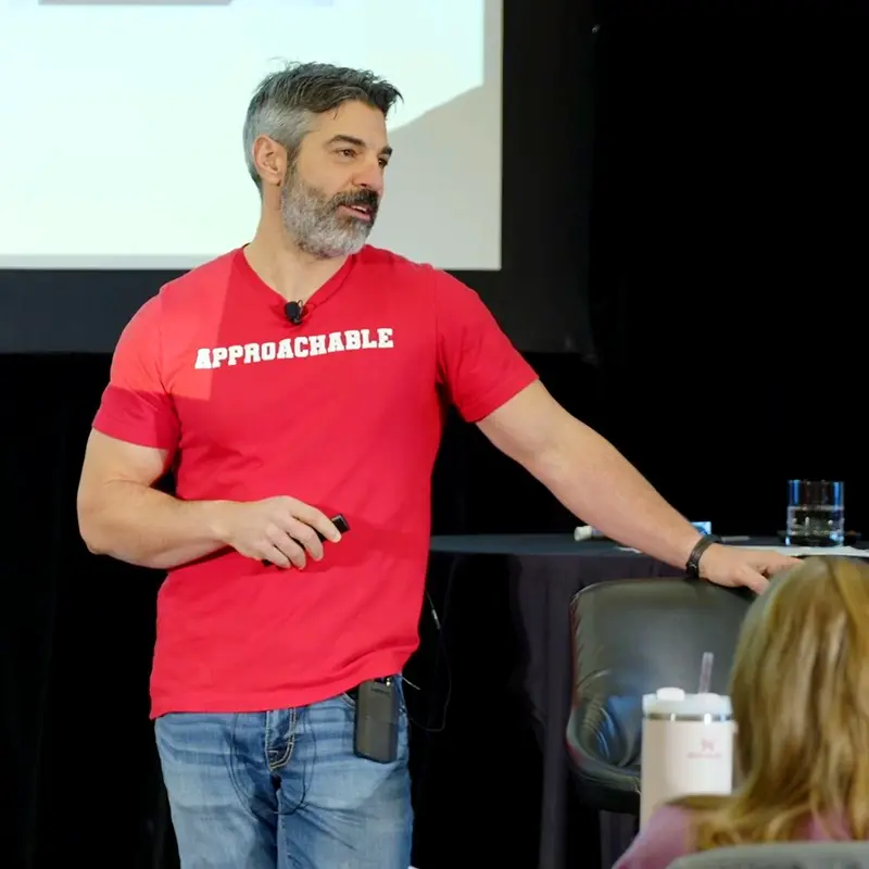 Image of Dr. Jason Tanoory speaking in front of a crowd